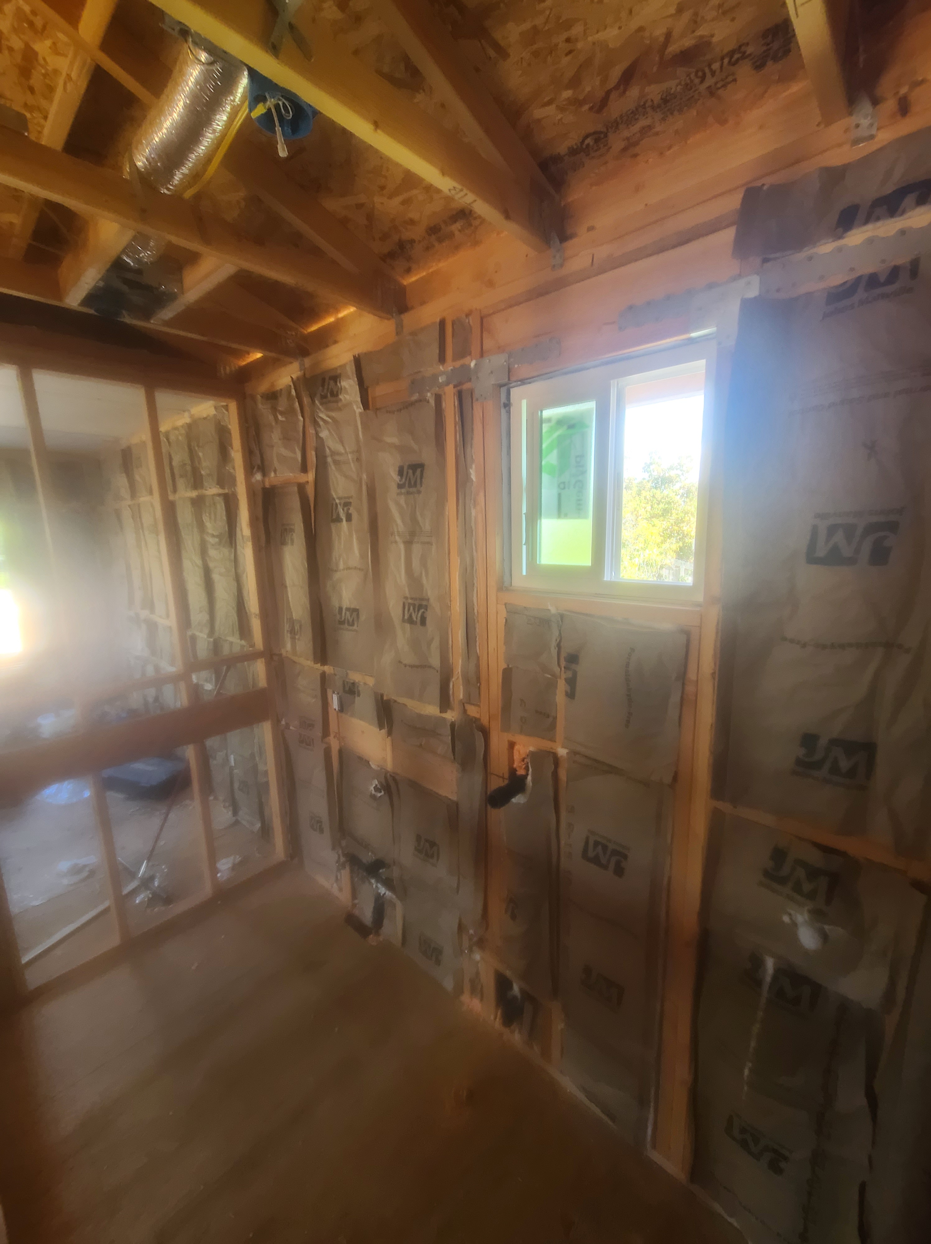 Interior wall framing with window and insulation