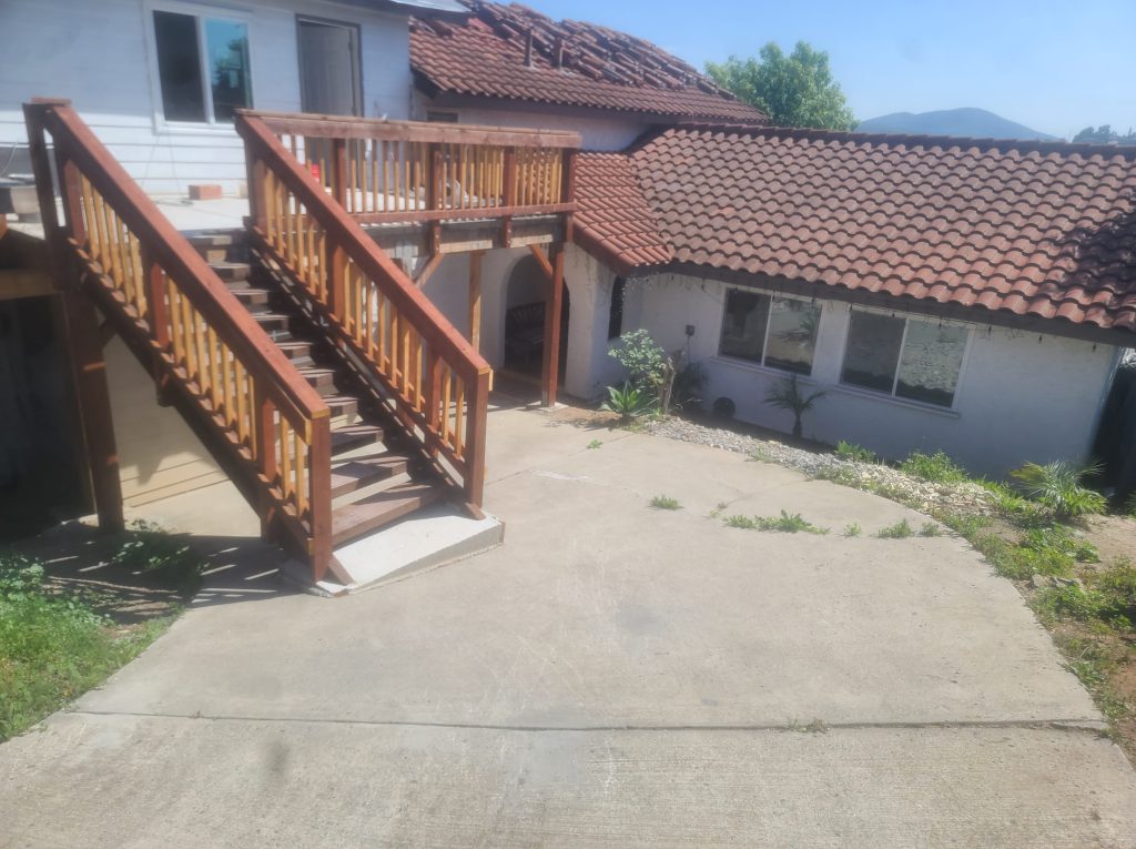 Exterior wood stair and deck on a stucco house